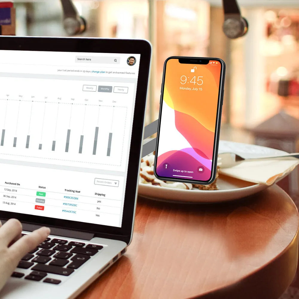 Silver aluminium laptop side mount bracket holding a tablet next to a laptop screen