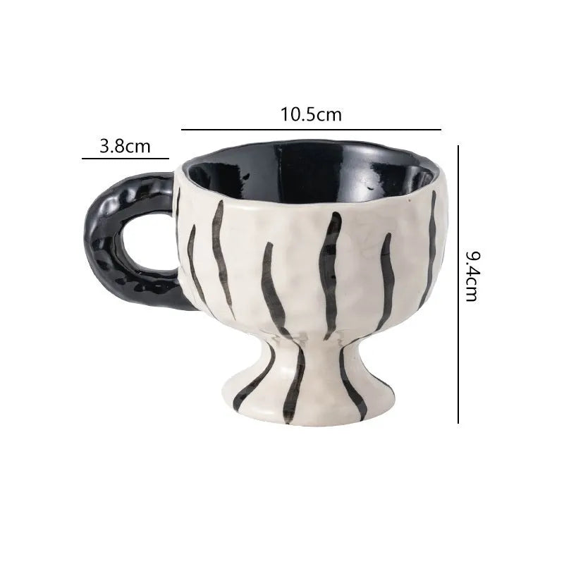 Hand-pinched irregular ceramic mug in solid colour with modern simple style, shown from side angle