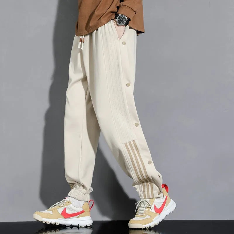 Men's loose grey sweatpants with ankle ties and belt, cotton blend fabric for autumn sports wear
