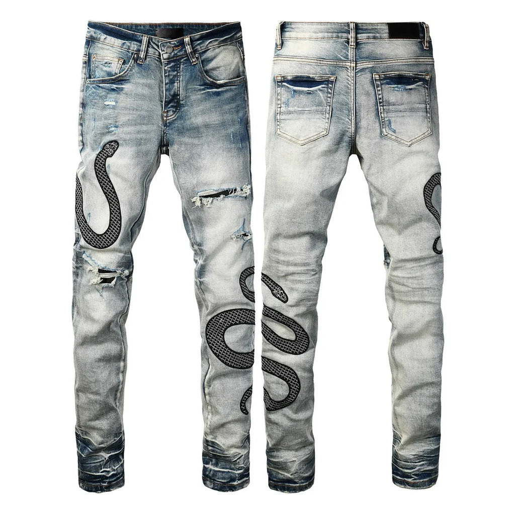 Man's blue distressed skinny jeans with a button fly and mid waist on a grey background.