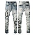Man's blue distressed skinny jeans with a button fly and mid waist on a grey background.