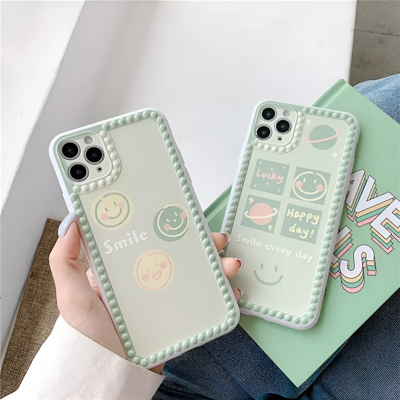 Green TPU iPhone case with smiley face pattern and polka dot frame geometric design