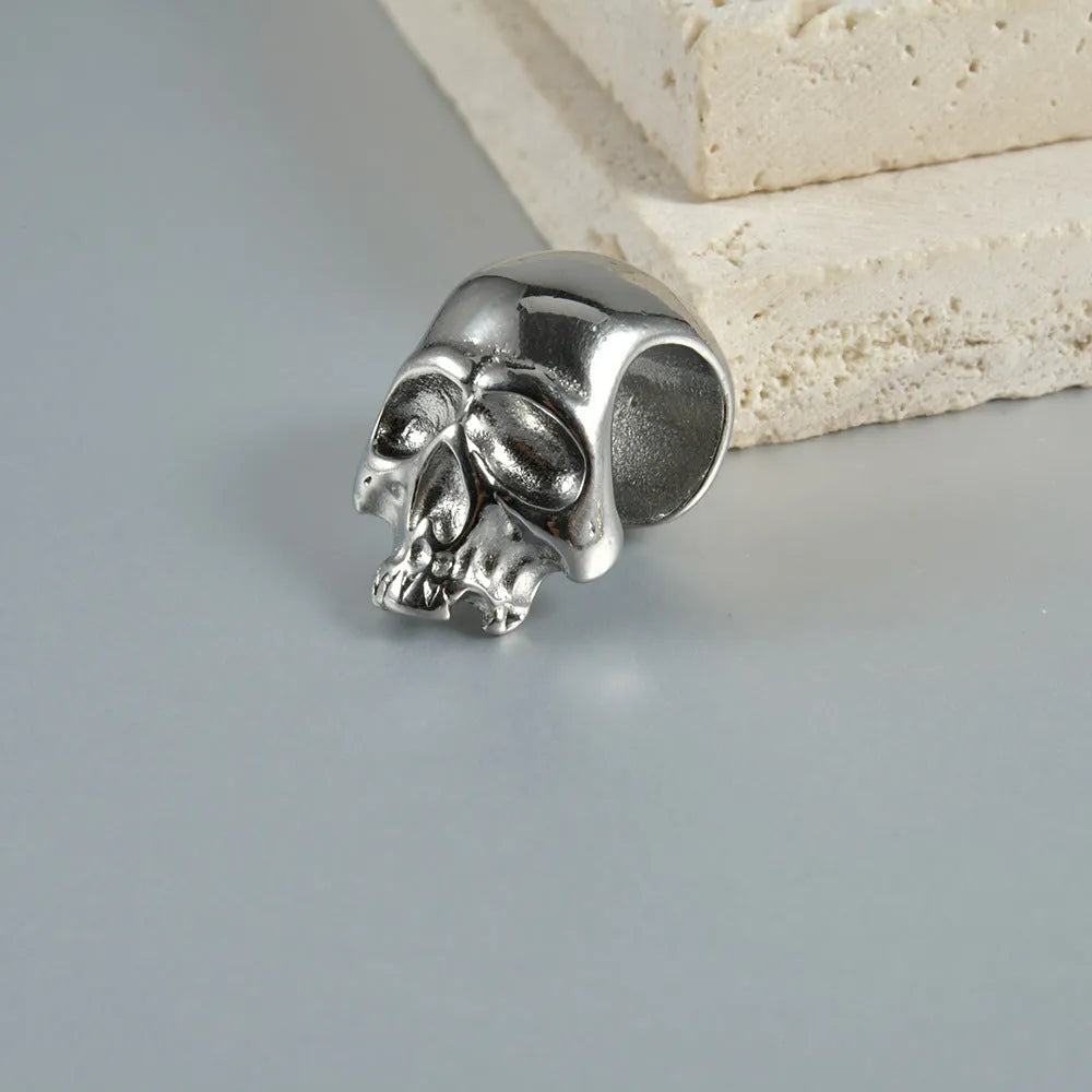 Stainless steel hollow geometric skull Buddha earrings for auricle piercing in electroplated colours