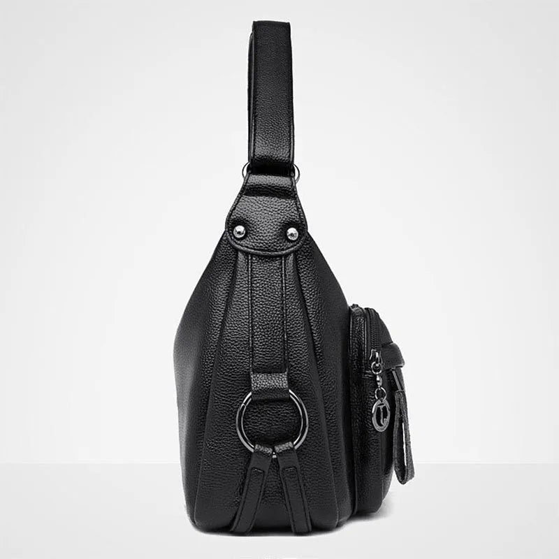 Large black PU shoulder bag with multiple internal compartments showing phone and document sections