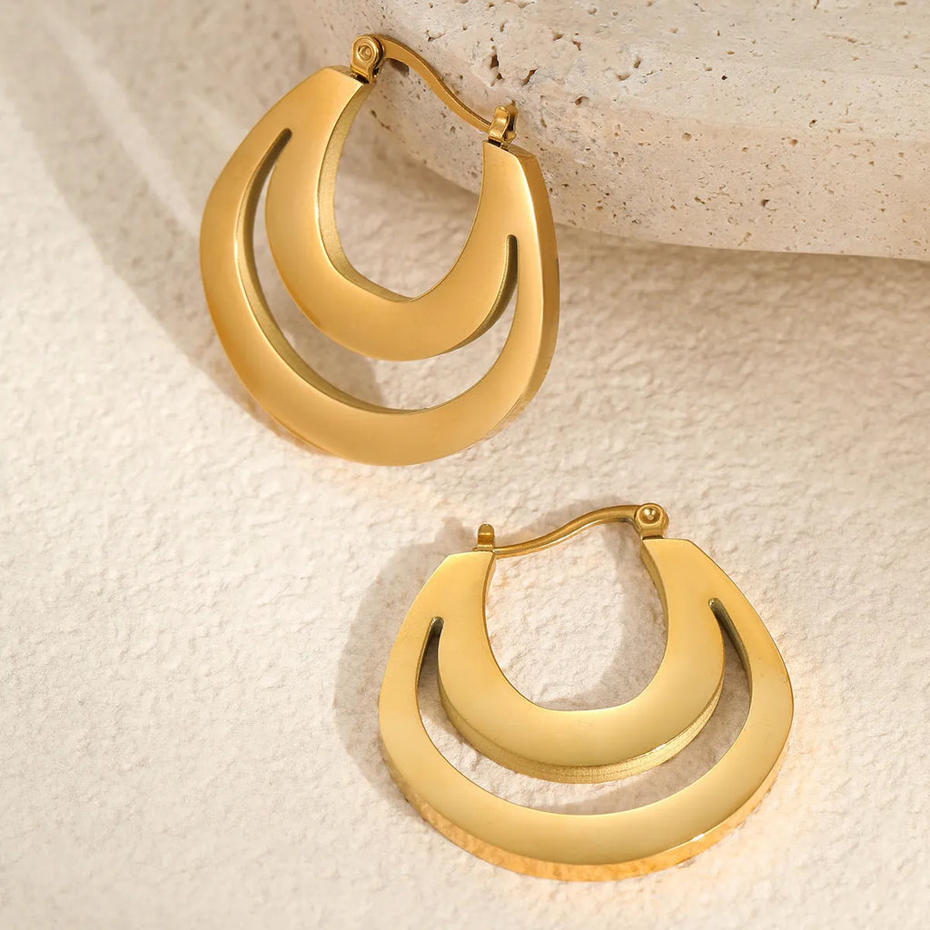 A pair of women's geometric French earrings with a round ring design, available in gold or steel colour.