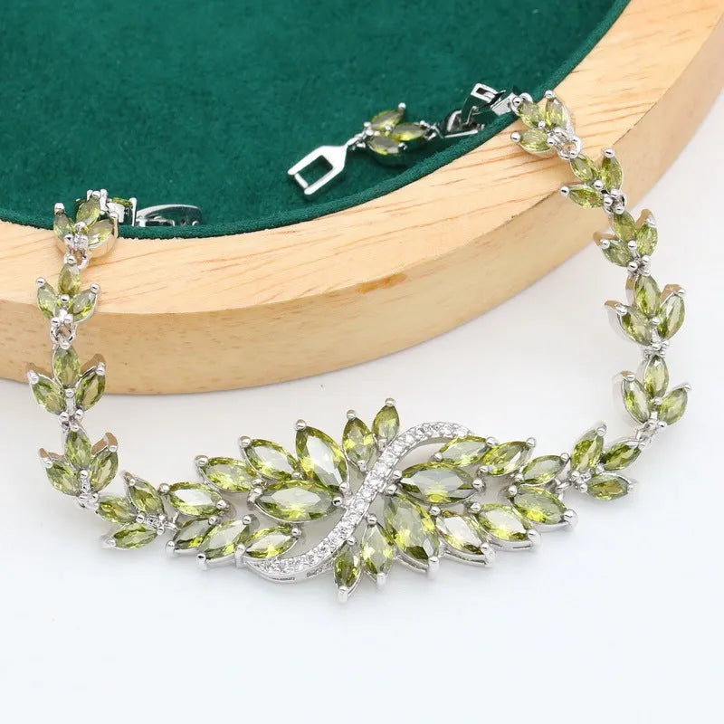 Complete retro floral jewellery set in copper with zircon stones, showing necklace, bracelet, earrings, and ring in olive green finish.