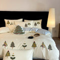 Cotton four-piece bedding set with embroidered Christmas tree towel design on duvet cover