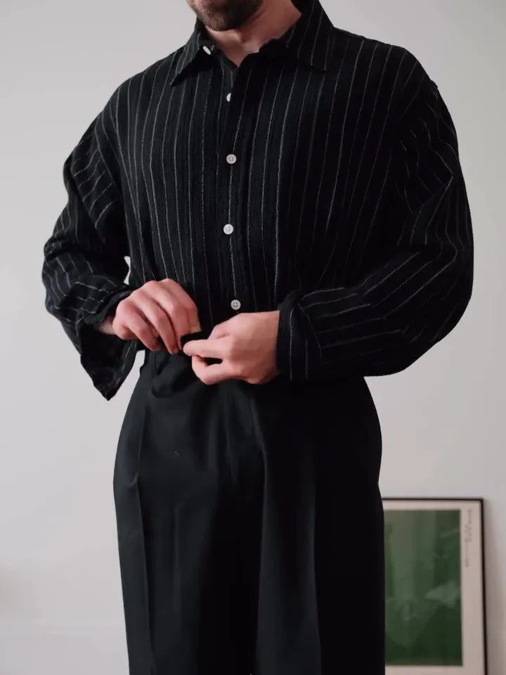Black pinstriped button-down shirt on hanger showing regular fit and classic striped pattern