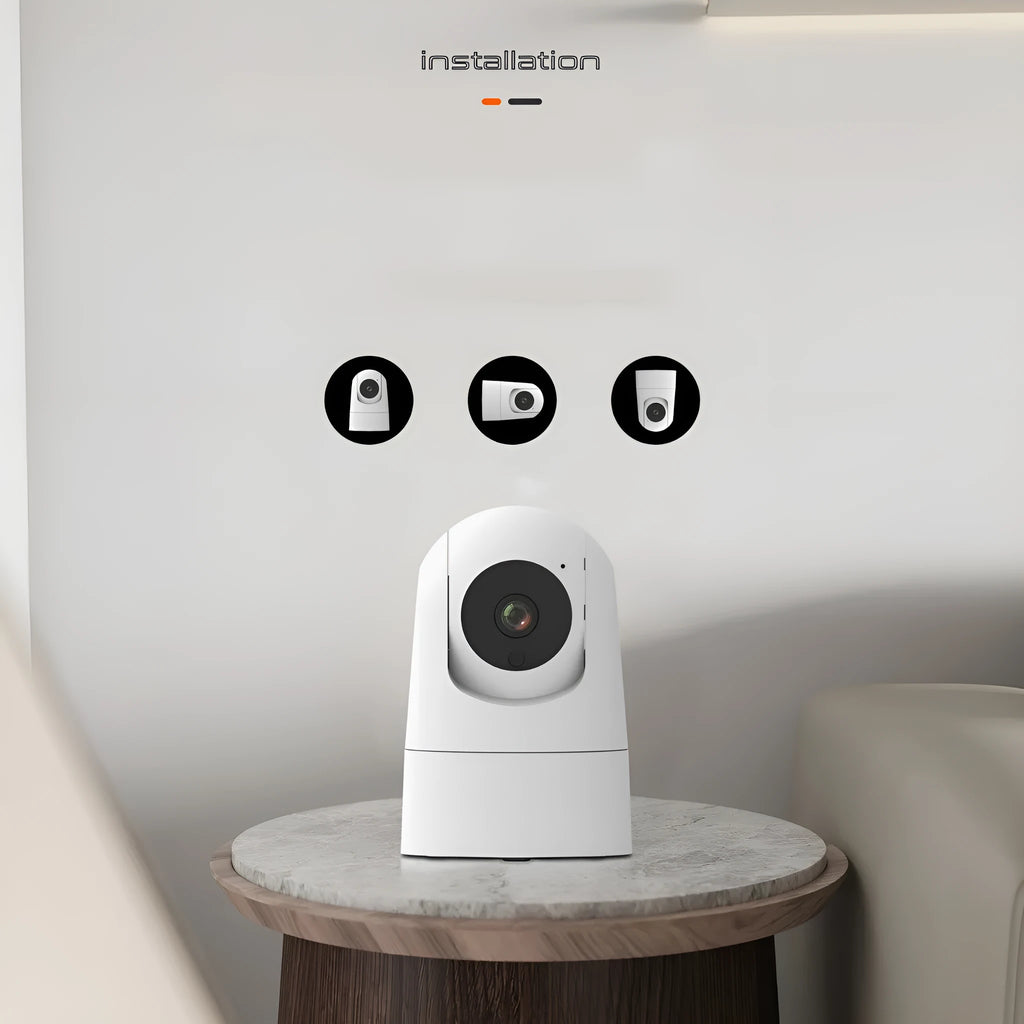 White indoor PTZ security camera with lens and mounting bracket on table