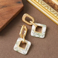 Geometric square hollow earrings with chamfered corners in electroplated copper