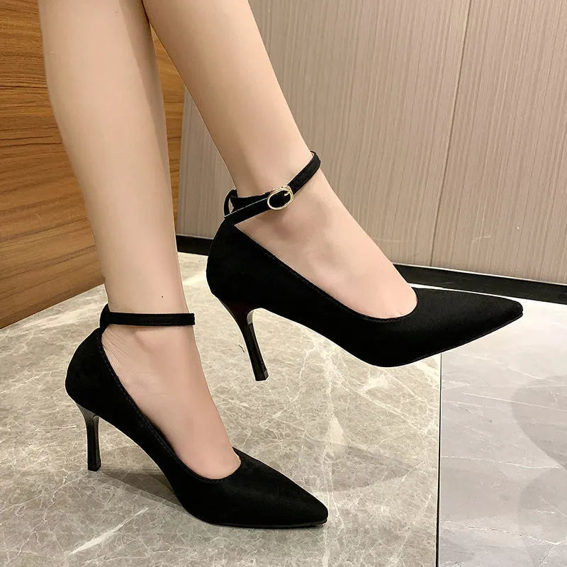 Women's black stiletto heel pump shoes with buckle detail and 8cm heel height