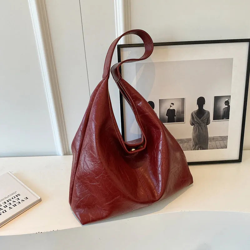 Casual soft leather shoulder bag with sandwich pockets in various colour options