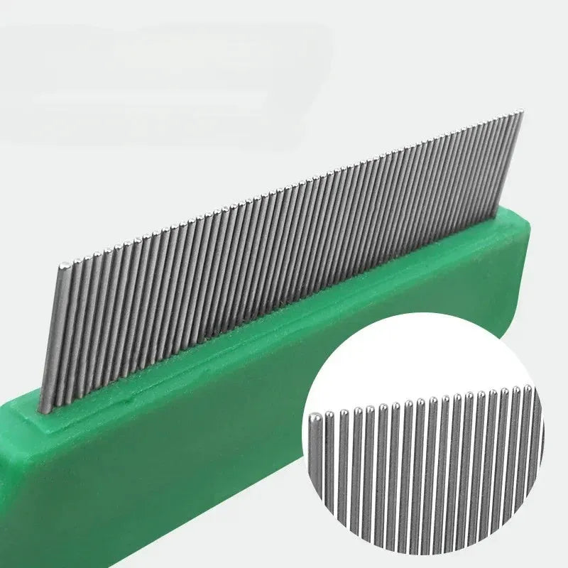 Green pet flea comb with stainless steel pins on plastic handle for dog and cat grooming