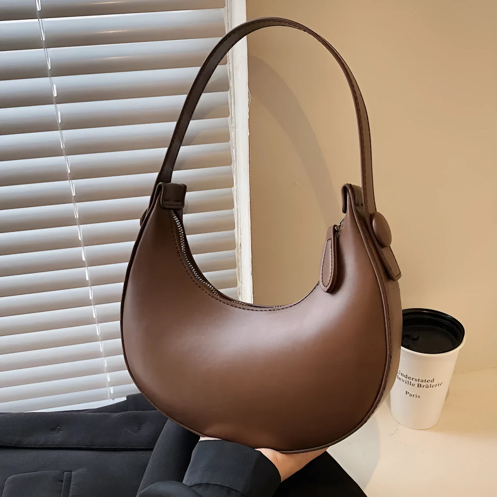 Women's retro dumpling-shaped shoulder bag in PU leather with a sandwich pocket.