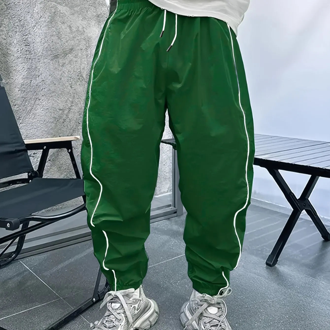 Men's loose-fit cropped sports trousers in bamboo fibre, shown in Army Green colour.