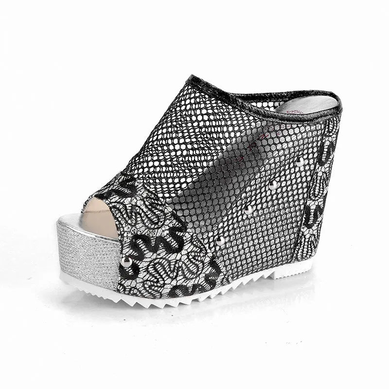 Women's black chunky heel platform sandals with hollowed-out heel design and lace-up mesh upper.