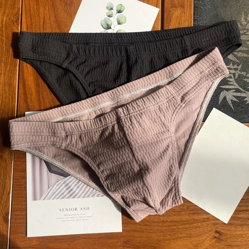 Men's solid colour cotton triangle underwear briefs in mid-waist design on a white background