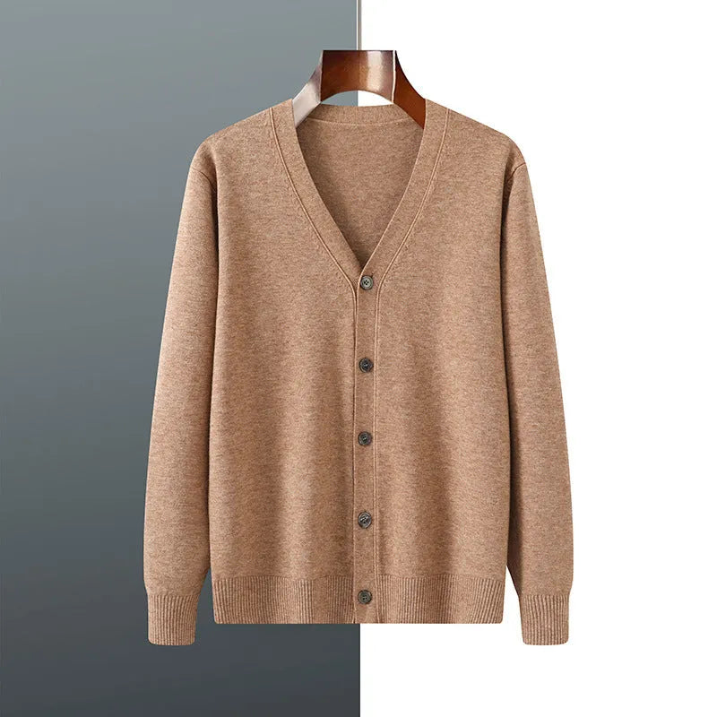 Man wearing a beige V-neck Andy velvet cardigan coat with a loose fit and long sleeves.