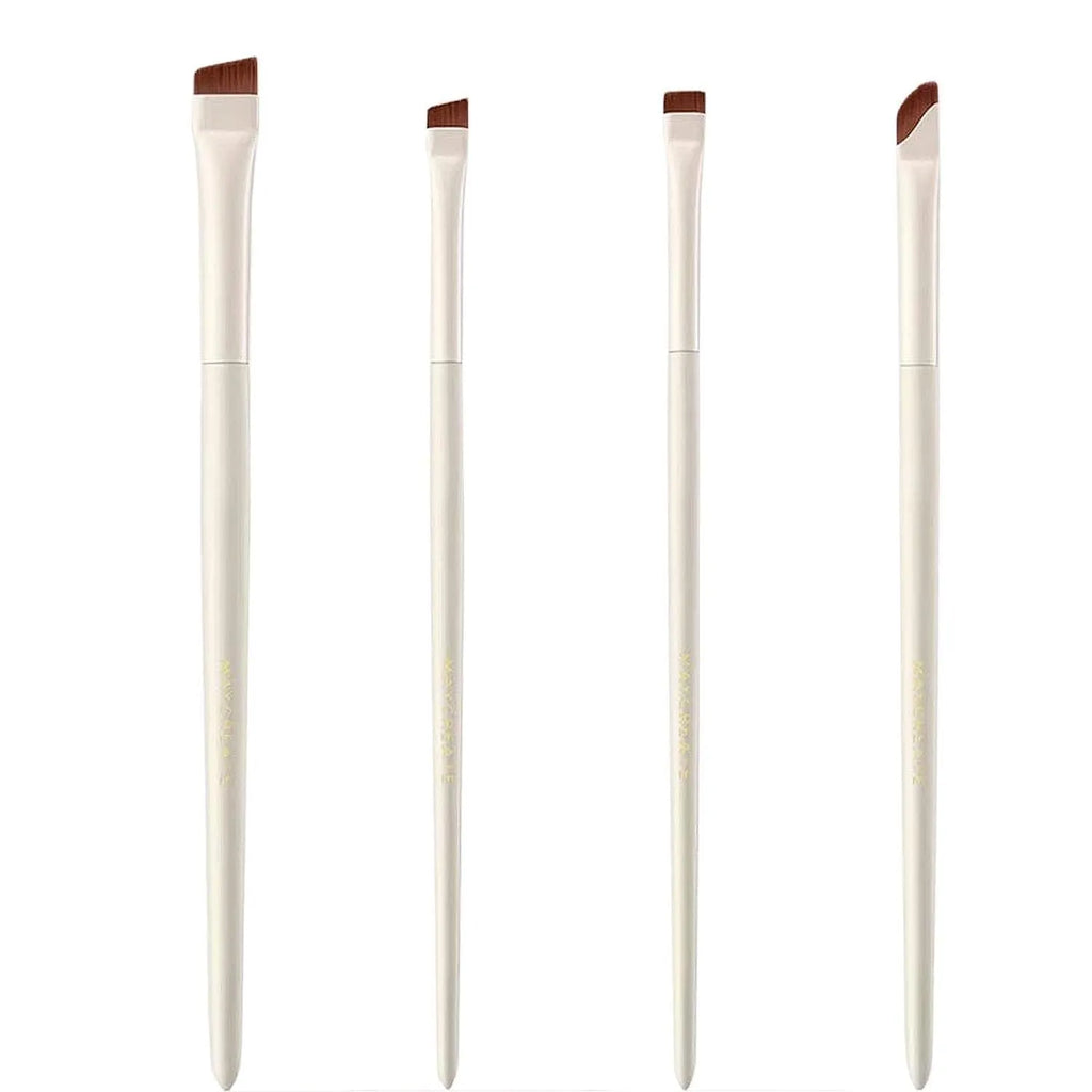Four angled eyeliner and eyebrow makeup brushes stored in a brown leather case.