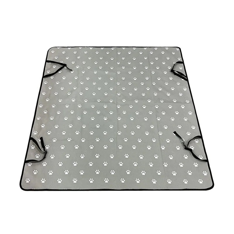 Dog car seat protector mat on rear bench seats in grey dog footprints pattern