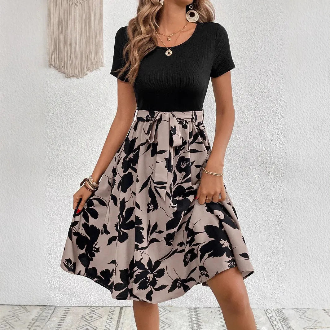 Women's khaki floral print A-line dress with shoulder strap detailing on hanger