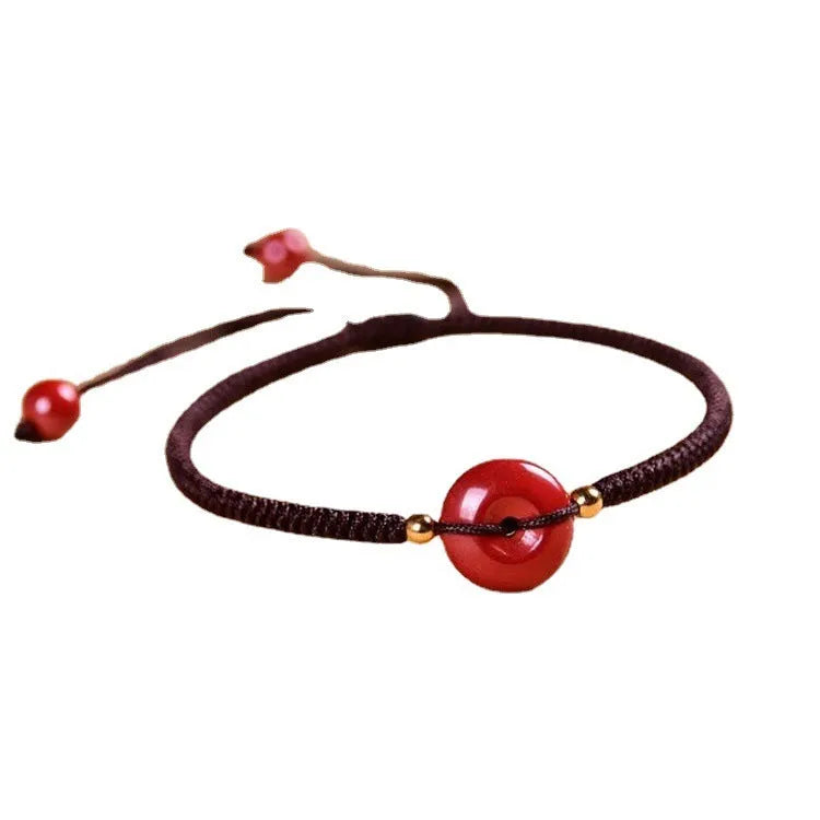 Cinnabar safety buckle bracelet with heart-shaped pendant on adjustable rope cord