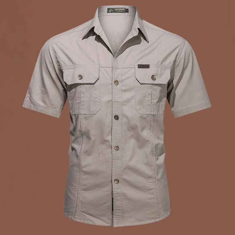 Men's short sleeve cotton work shirt in a loose fit, shown in army green colour.