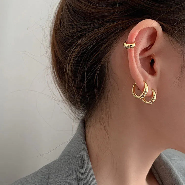 Women's geometric water drop earrings in gold and silver with minimalist round design