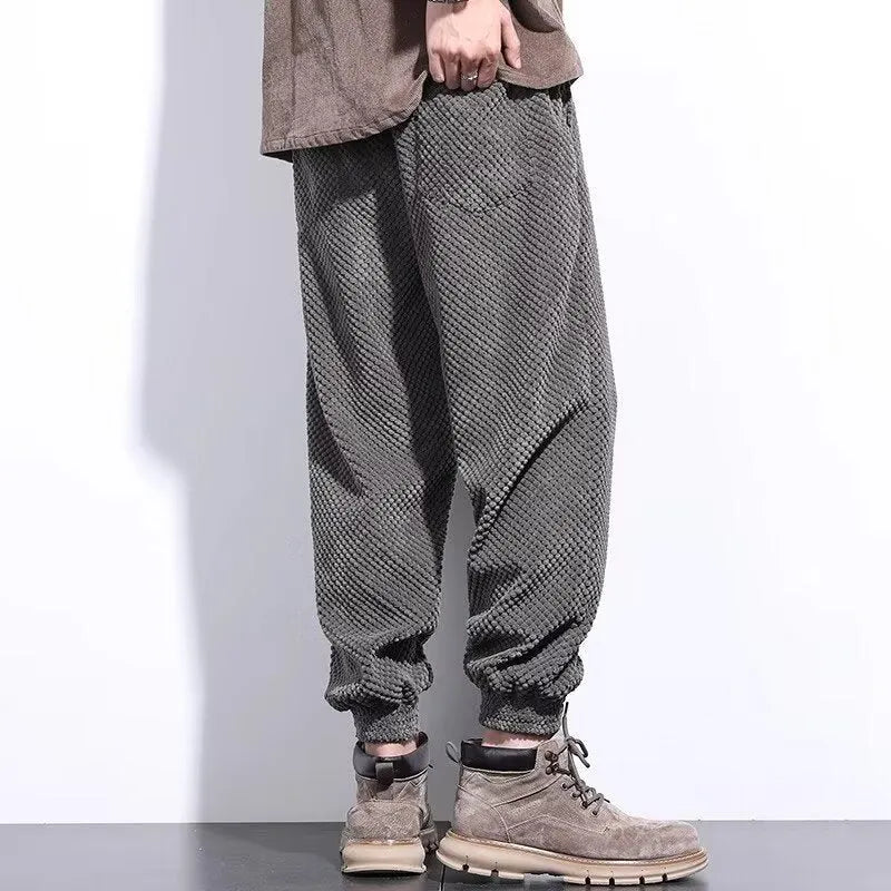 Men's grey straight leg sweatpants with an ankle-tie closure, laid flat.