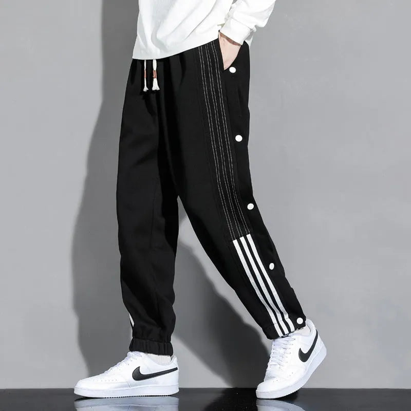 Men's loose grey sweatpants with ankle ties and belt, cotton blend fabric for autumn sports wear
