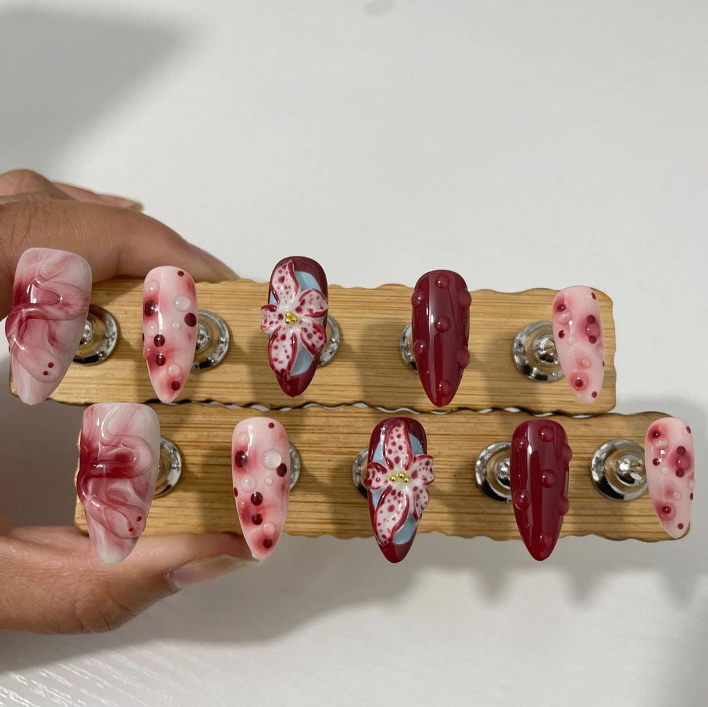 Hand-painted 3D carved manicure nails in almond colour with rose and tulip floral patterns