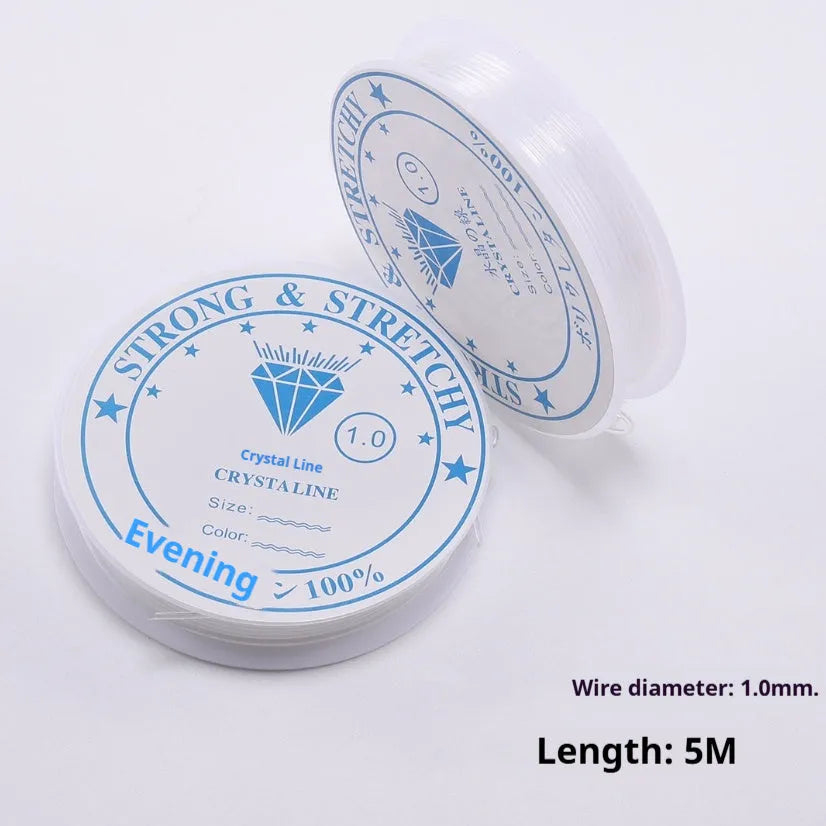 Reel of transparent white elastic fishing line for DIY crafts and jewellery.