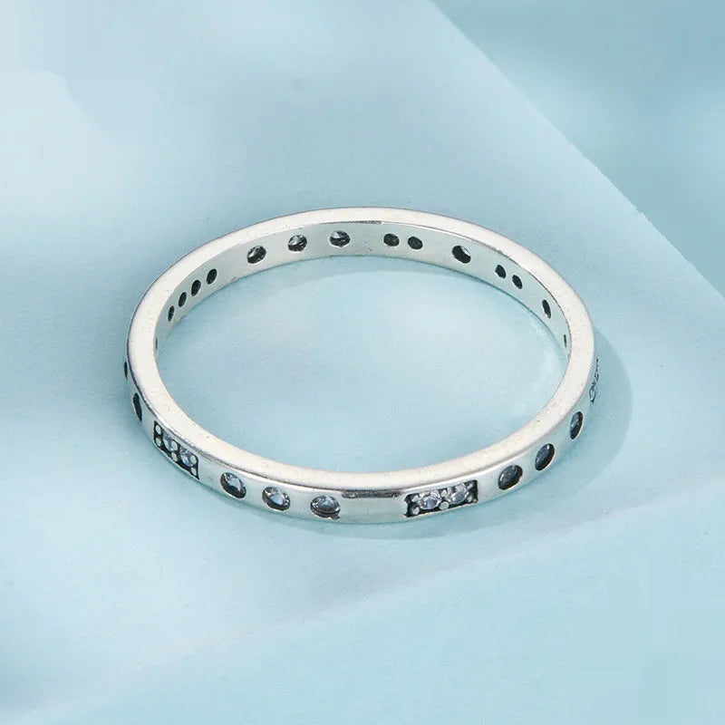 Oxidised black silver 'I Love You' moss password fashion ring on a hand, showing its bracelet-style design.