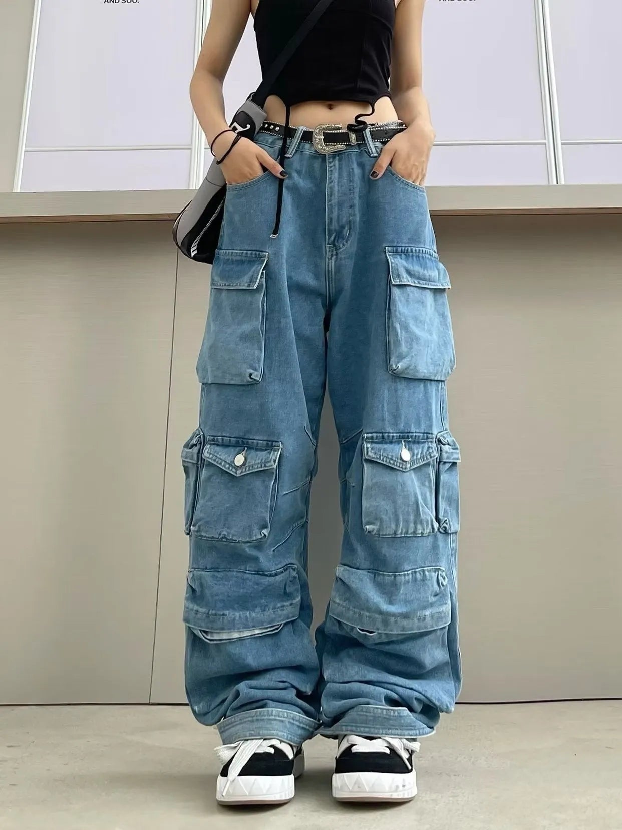 Women's blue tie-dyed high waist wide leg denim trousers with multiple pockets and elastic waistband