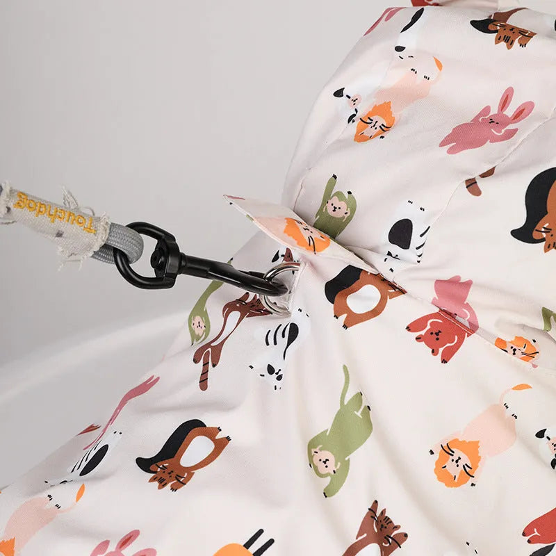 Beige dog raincoat with cartoon animal design in waterproof PU material
