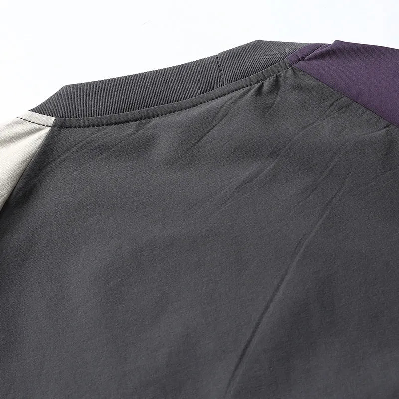 Dark grey men's loose fit T-shirt with contrast colour panels and raglan sleeves.