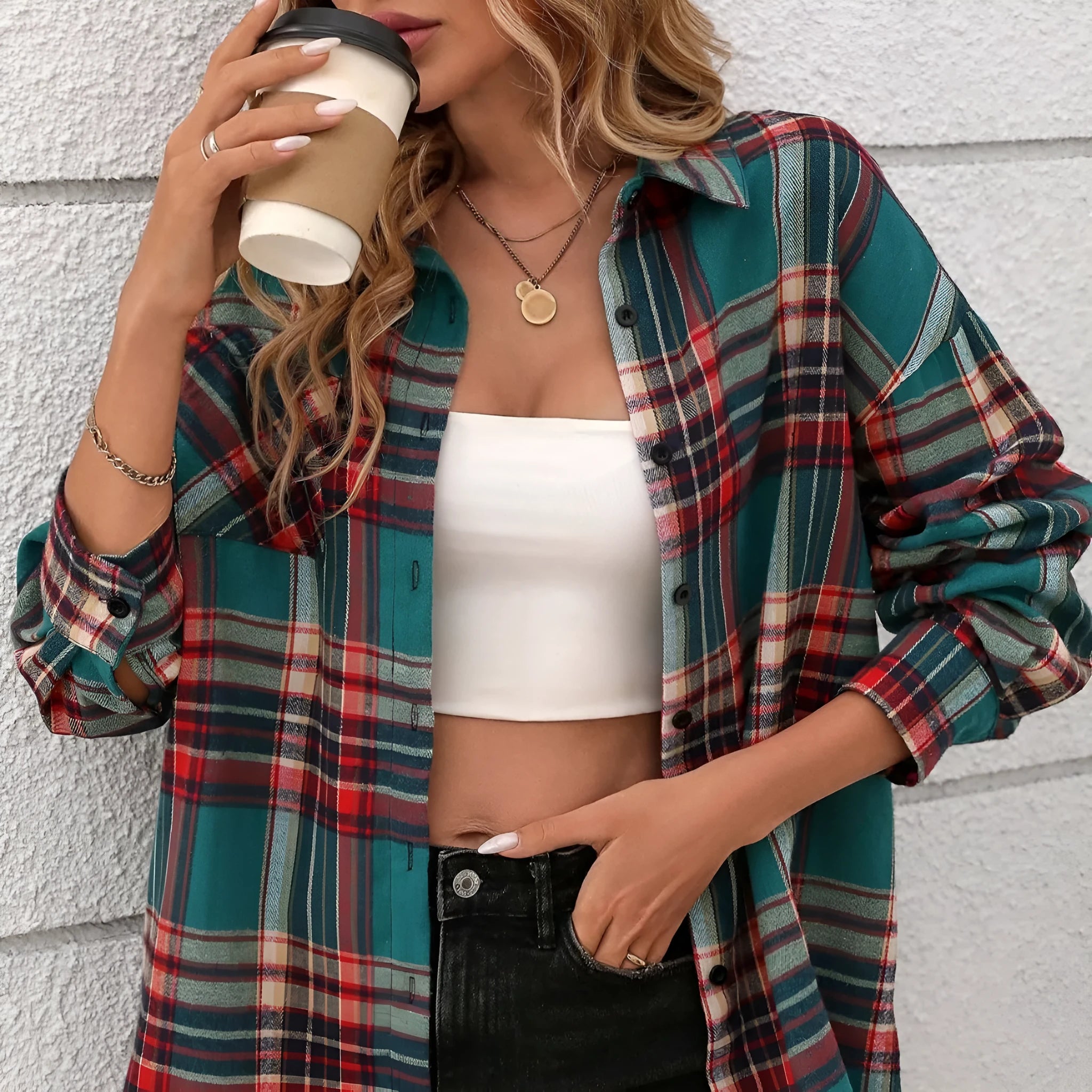 Women's loose fit black plaid long sleeve cotton shirt on a hanger.