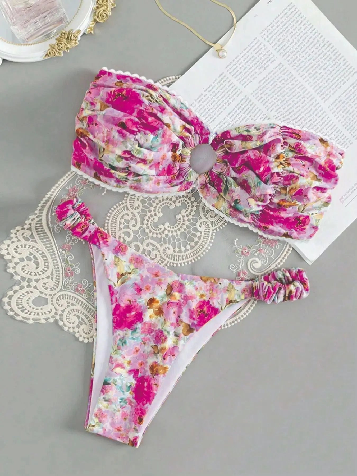 Printed tube top bikini set with lace detail and floral pattern in blue colour