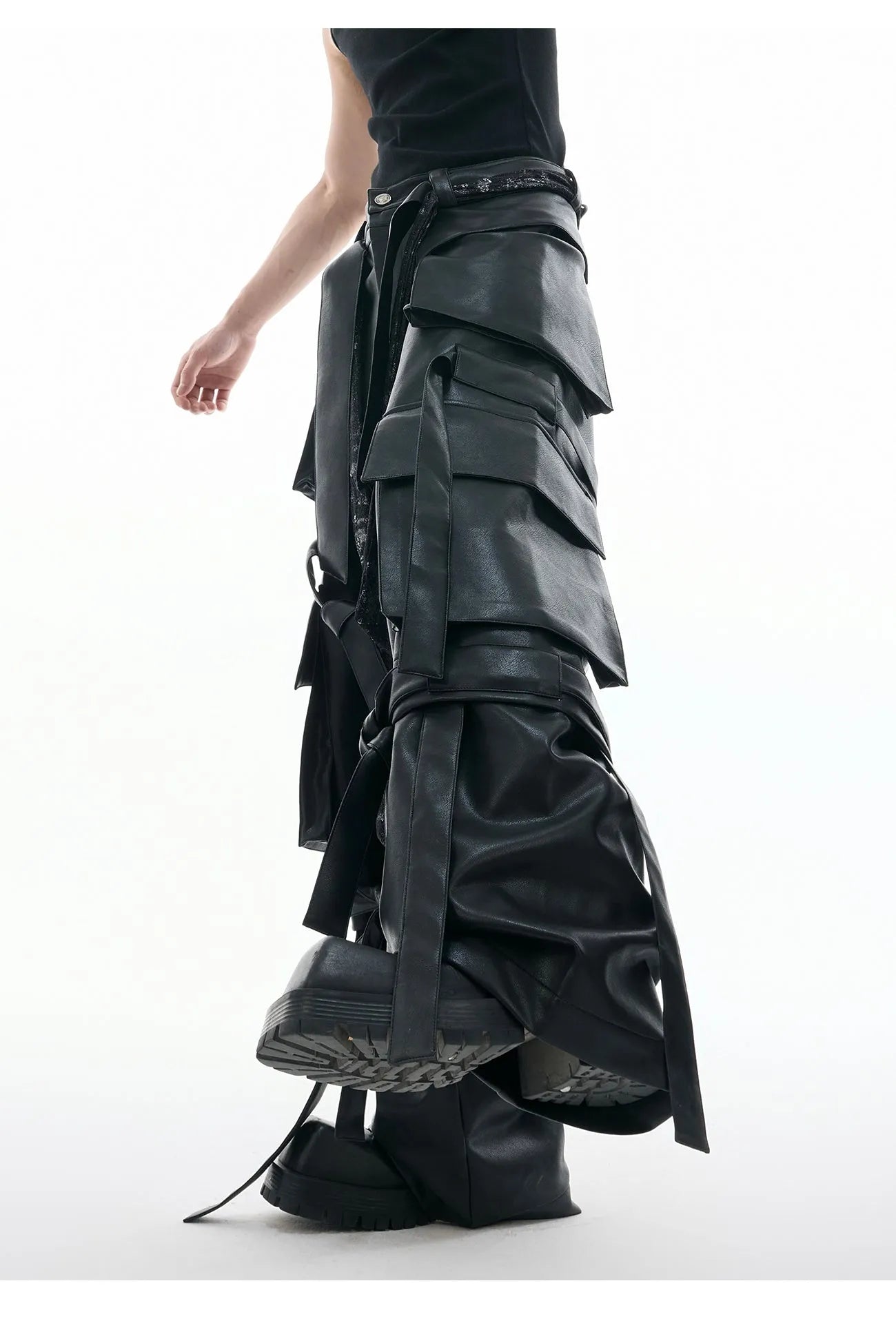 Black loose-fit retro leather-look pants with quilted texture and multi-pocket stitching detail.