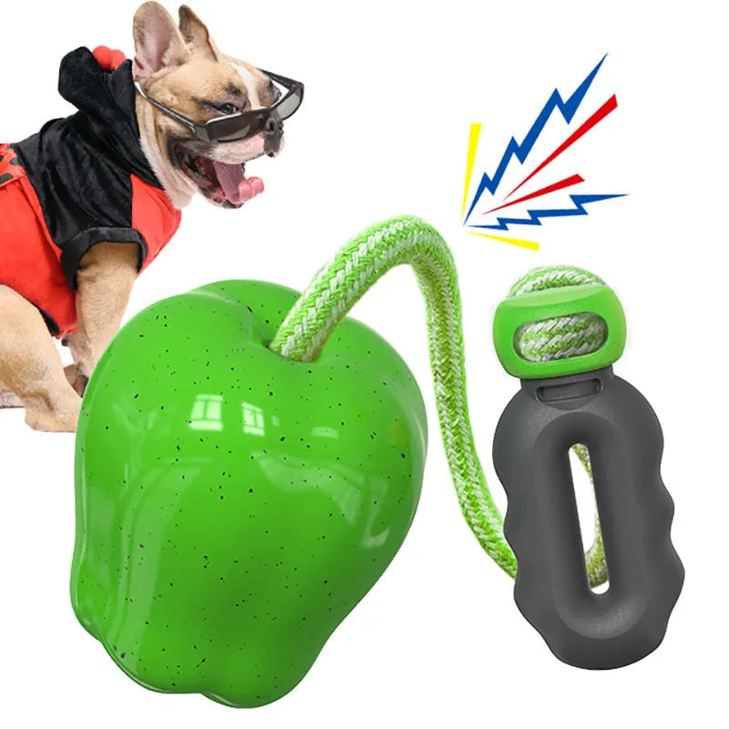 Green Apple-shaped plastic dog toy with dropping ball design containing squeaker