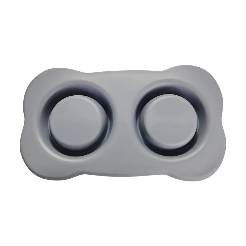 Large black silicone dog bowl seated inside a weighted stainless steel base