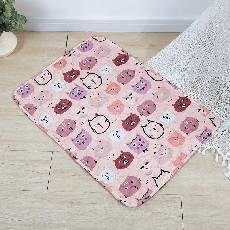Reusable washable pet urine pad with colourful animal print and waterproof non-slip backing.