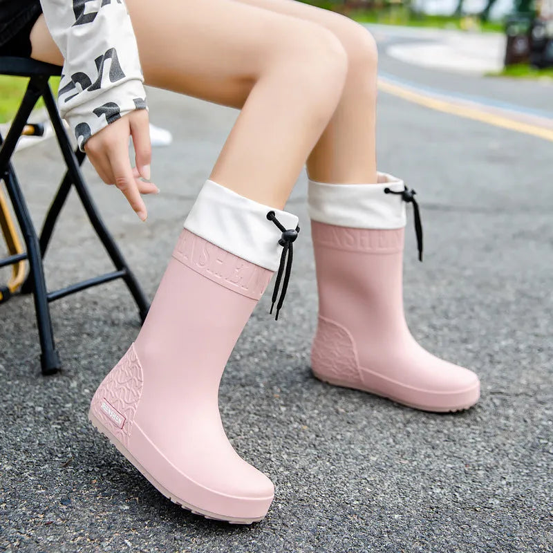 Women's PVC rain boots in apricot colour with non-slip soles and waterproof mouth detailing