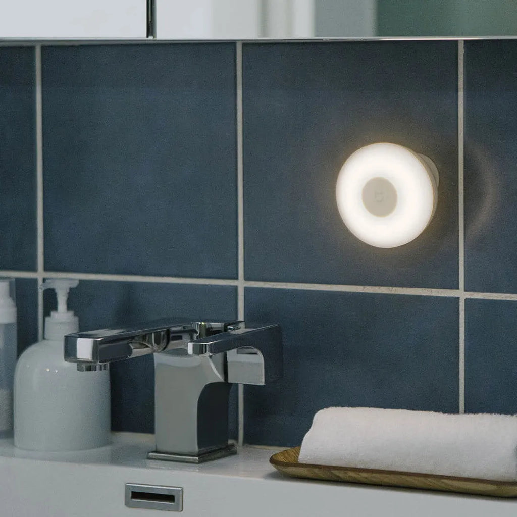 White Mijia Night Light 2 Bluetooth lamp with PC shade and inductive sensor on bedside table