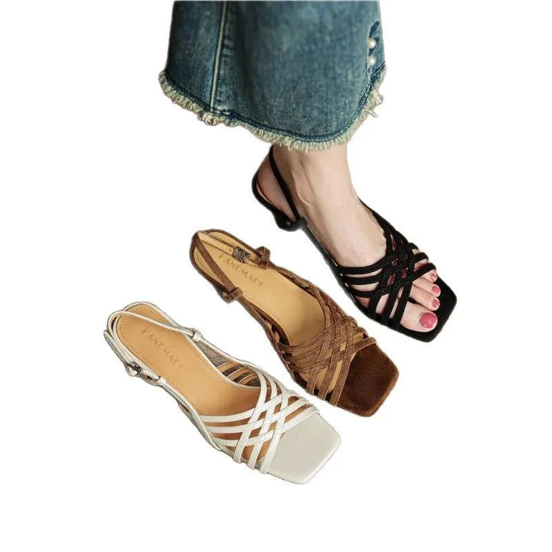 Retro style women's sandals with thin cross straps, ankle buckle, square toe, and a mid-height heel.