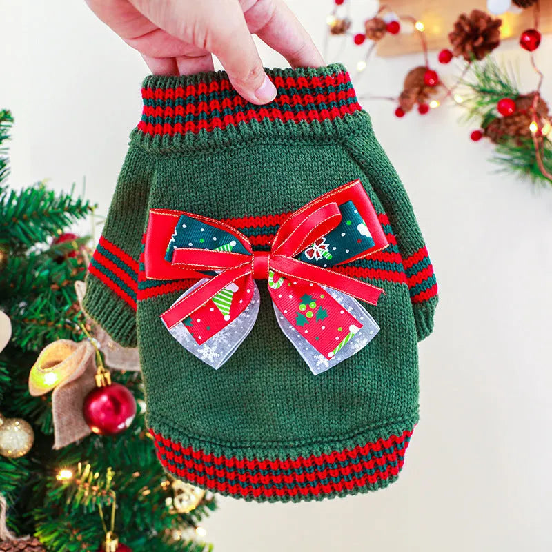 Red and green Merry Christmas dog jumpers for small to large pets on a festive background