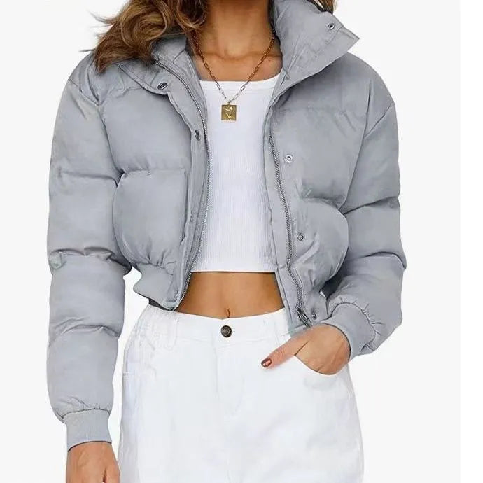 Women's loose blue polyester jacket with regular long sleeves showing front view