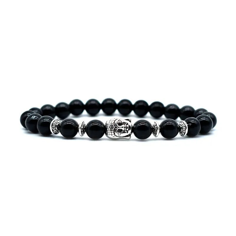 Handcrafted unisex bracelet with a 19mm Buddha head bead in tiger eye stone on wrist.