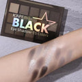 Matte eyeshadow palette showing fifteen colours in brown and blue shades with shimmer finishes