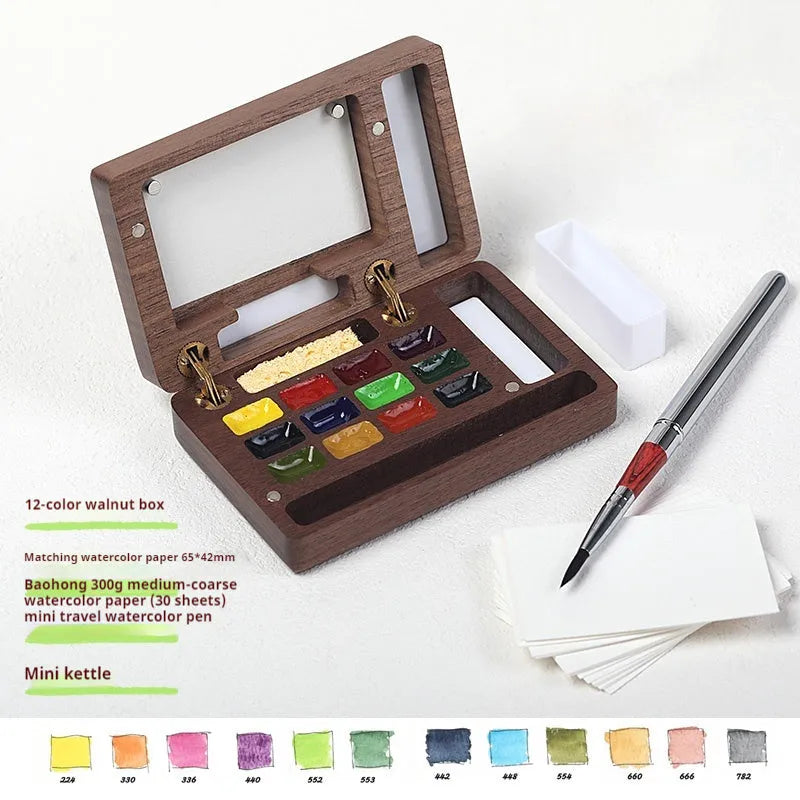 Mini wooden walnut watercolour paint box open showing pigment pans with choice of Schmincke, Holbein, Picasso, or Moonlight colour sets.